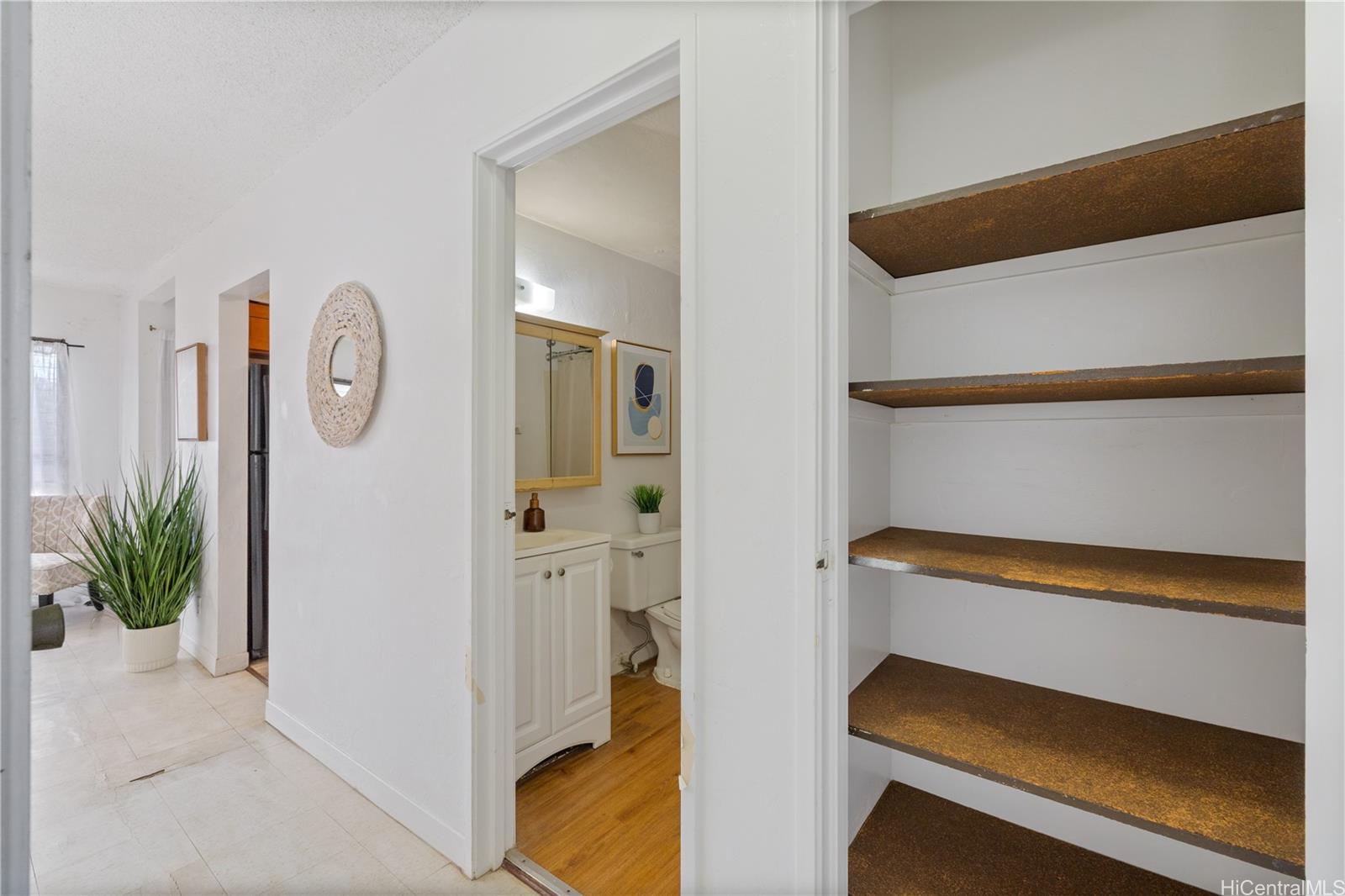 87-119 Helelua Street, Unit F204 Waianae, HI 96792 - Photo 8 of 24 a view of room with wooden floor and small entryway