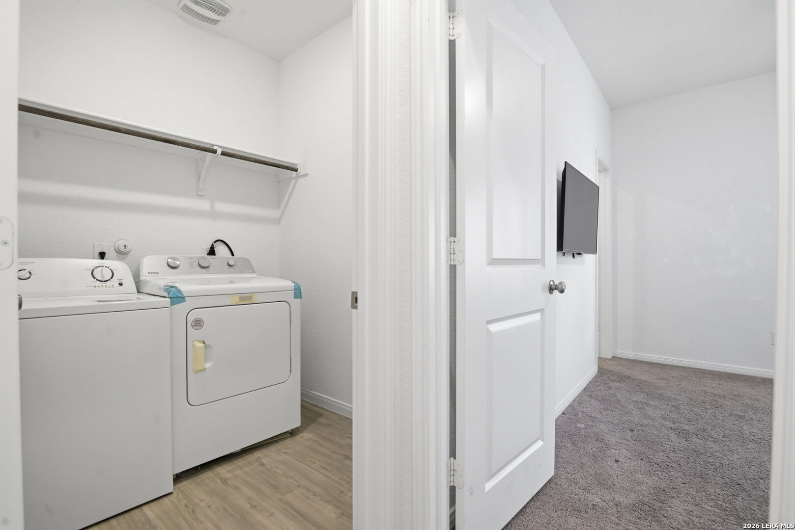 12811 Sage Turn St. Hedwig, TX 78152 - Photo 12 of 28 a utility room with dryer and washer