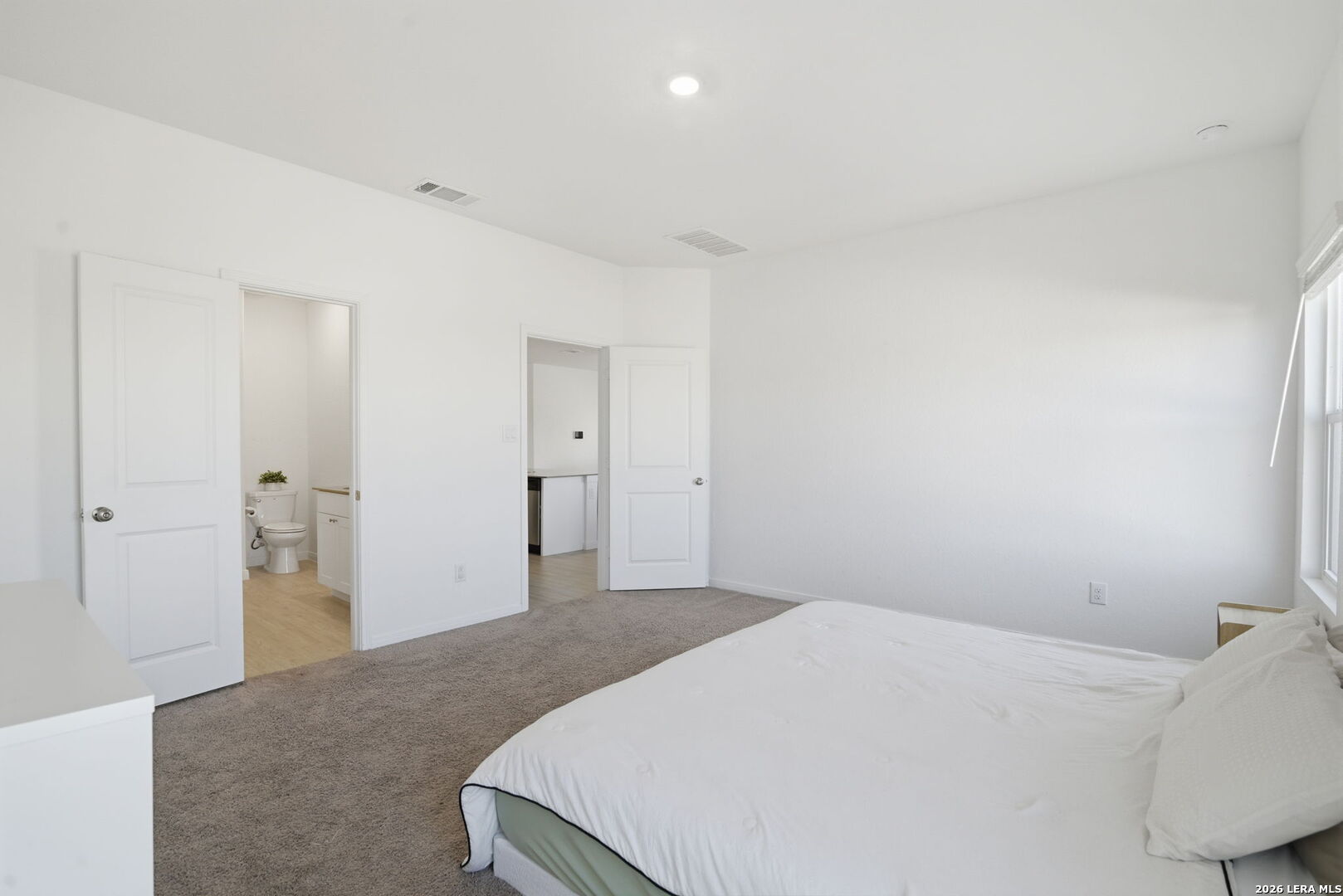 12811 Sage Turn St. Hedwig, TX 78152 - Photo 13 of 28 a bedroom with a bed and a cabinets