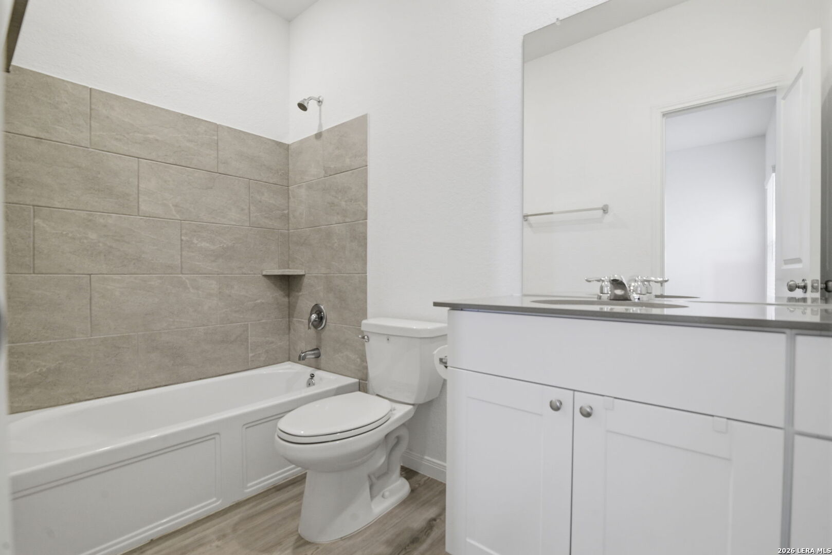 12811 Sage Turn St. Hedwig, TX 78152 - Photo 19 of 28 a bathroom with a toilet a sink and a bathtub