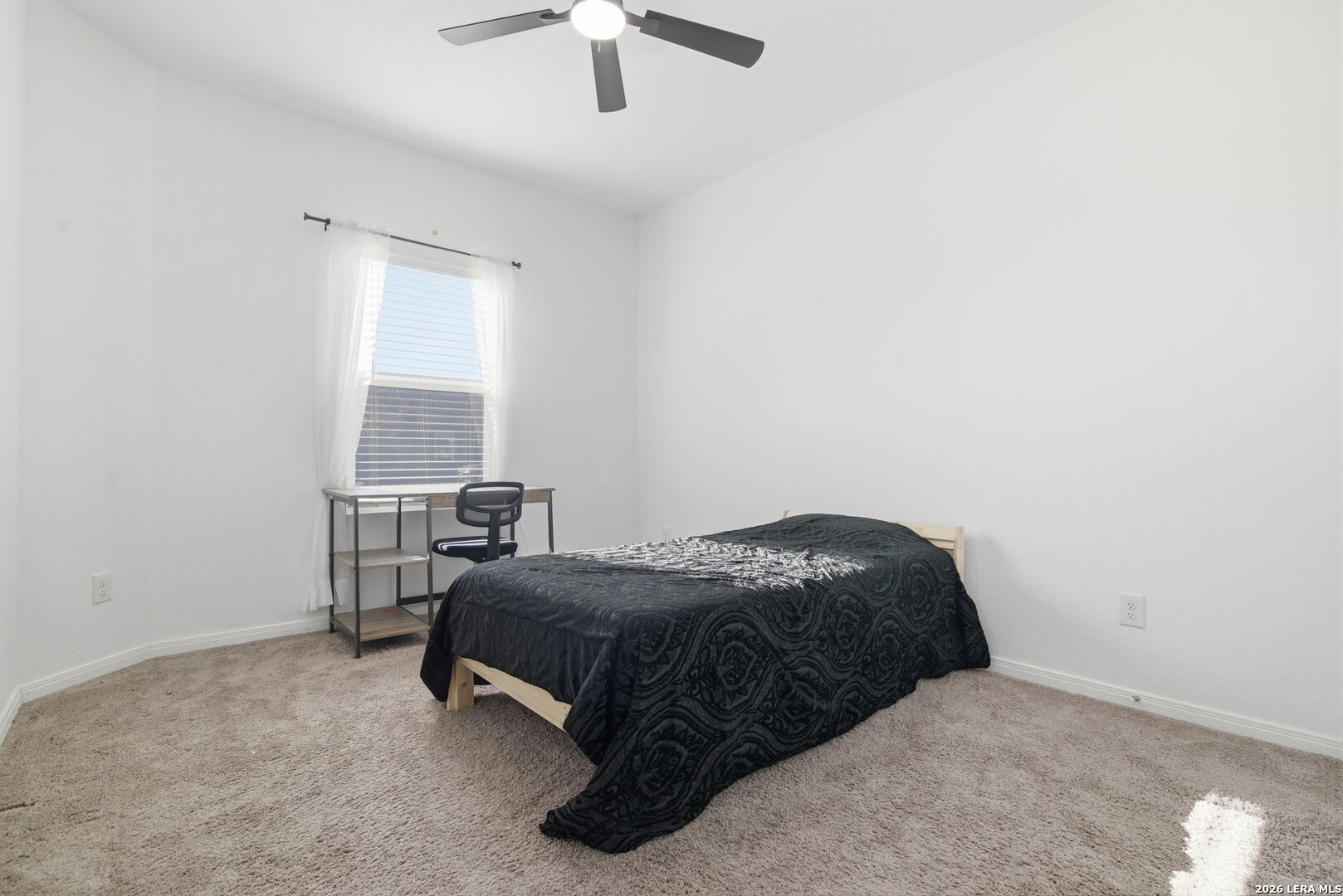 12811 Sage Turn St. Hedwig, TX 78152 - Photo 20 of 28 a bedroom with a bed and a ceiling fan