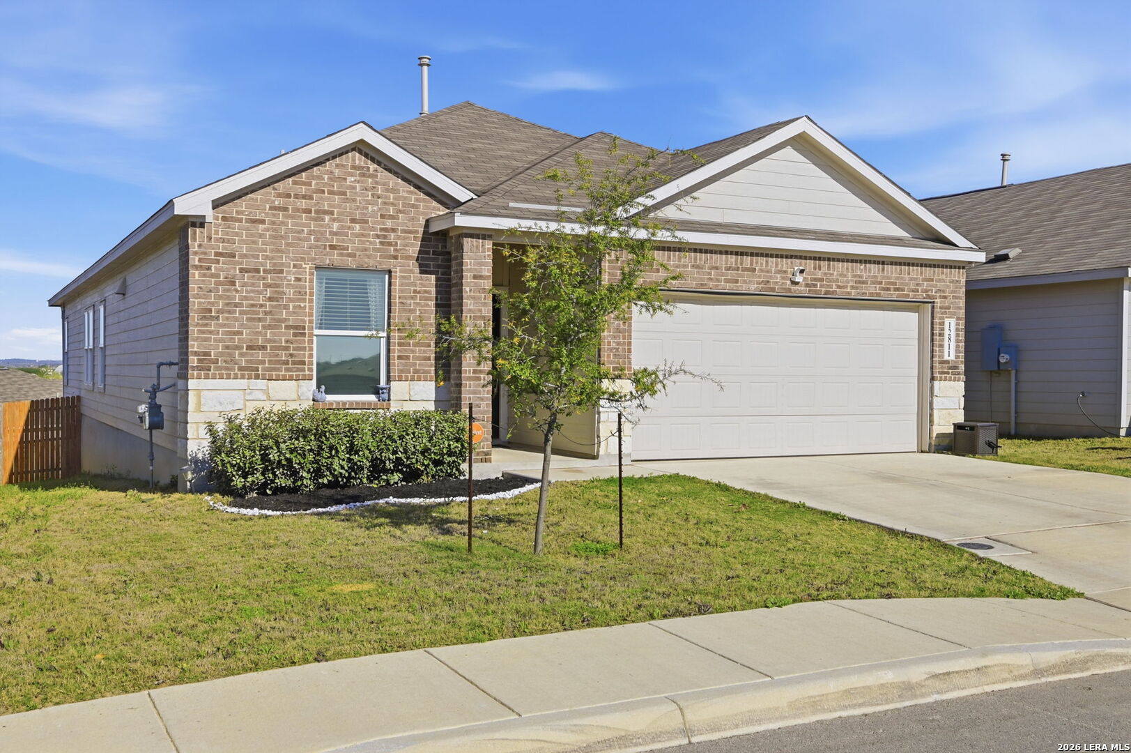 12811 Sage Turn St. Hedwig, TX 78152 - Photo 2 of 28 a front view of a house with a yard