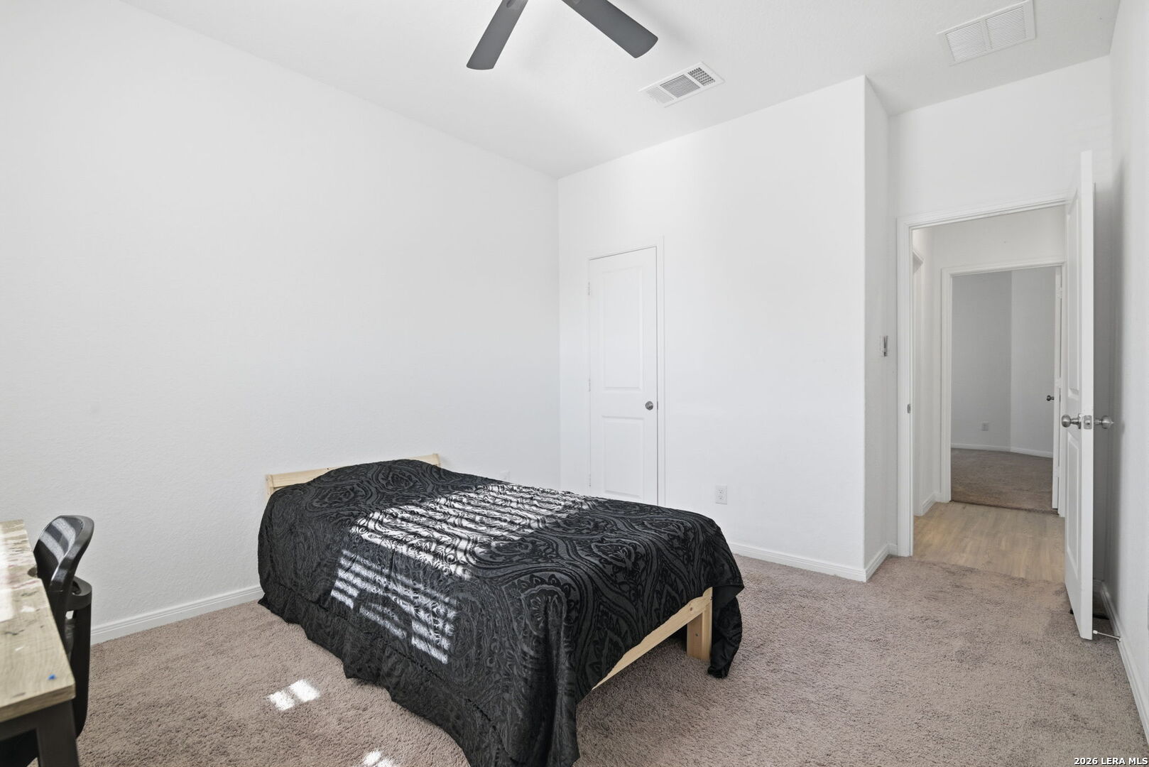 12811 Sage Turn St. Hedwig, TX 78152 - Photo 21 of 28 a bedroom with a bed and a chandelier