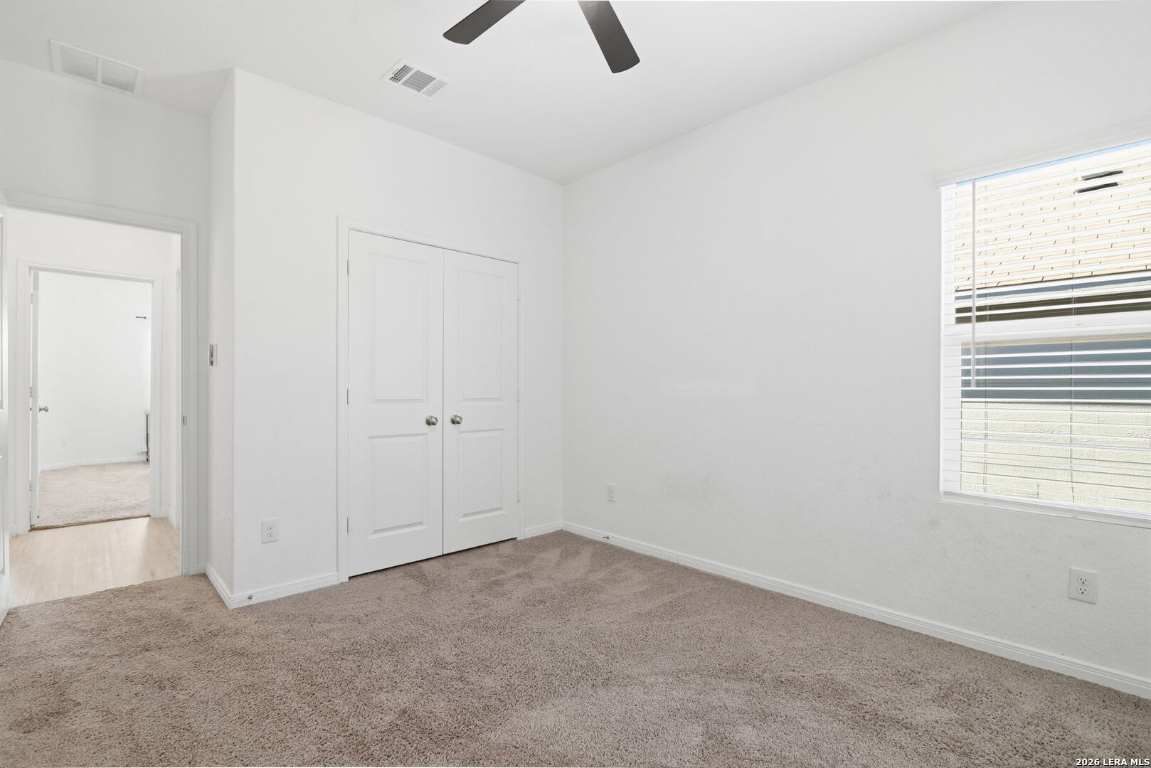 12811 Sage Turn St. Hedwig, TX 78152 - Photo 24 of 28 an empty room with closet and windows