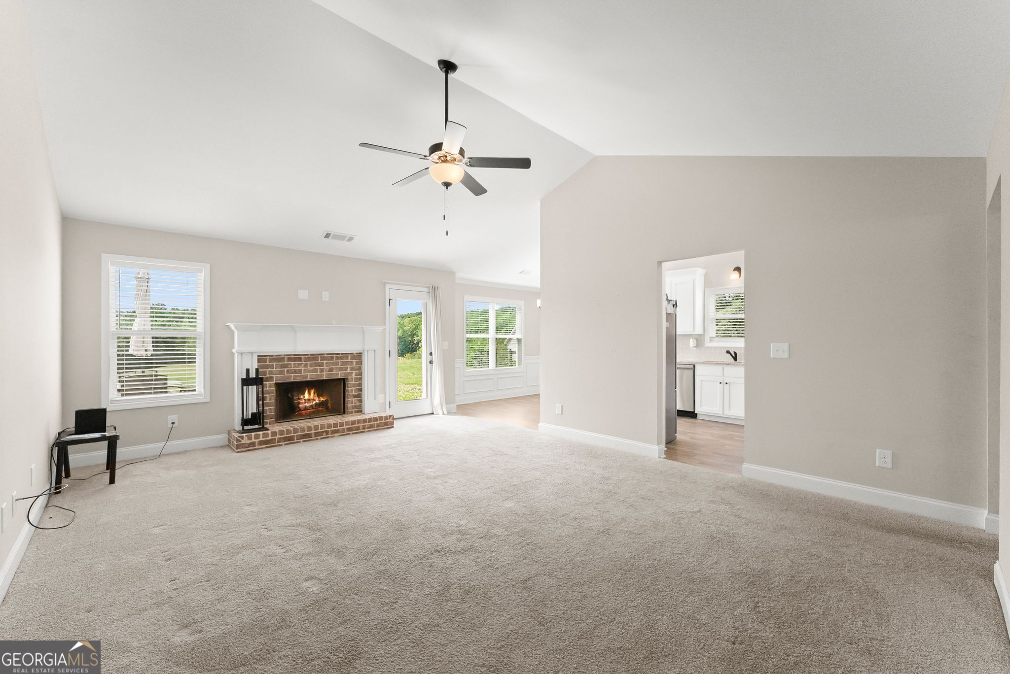 810 Anderson Thomas Road Martin, GA 30557 - Photo 7 of 40 a view of an empty room with a fireplace and a window