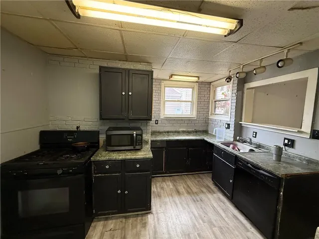 a bathroom with a toilet and a mirror