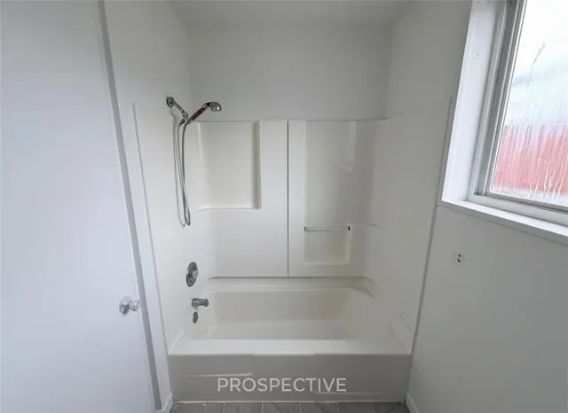 a view of a balcony with two chairs and a table