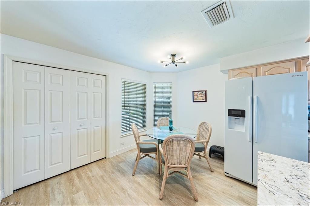 231 Via Perignon, Unit 204 Naples, FL 34119 - Photo 13 of 26 a view of a livingroom with furniture and wooden floor