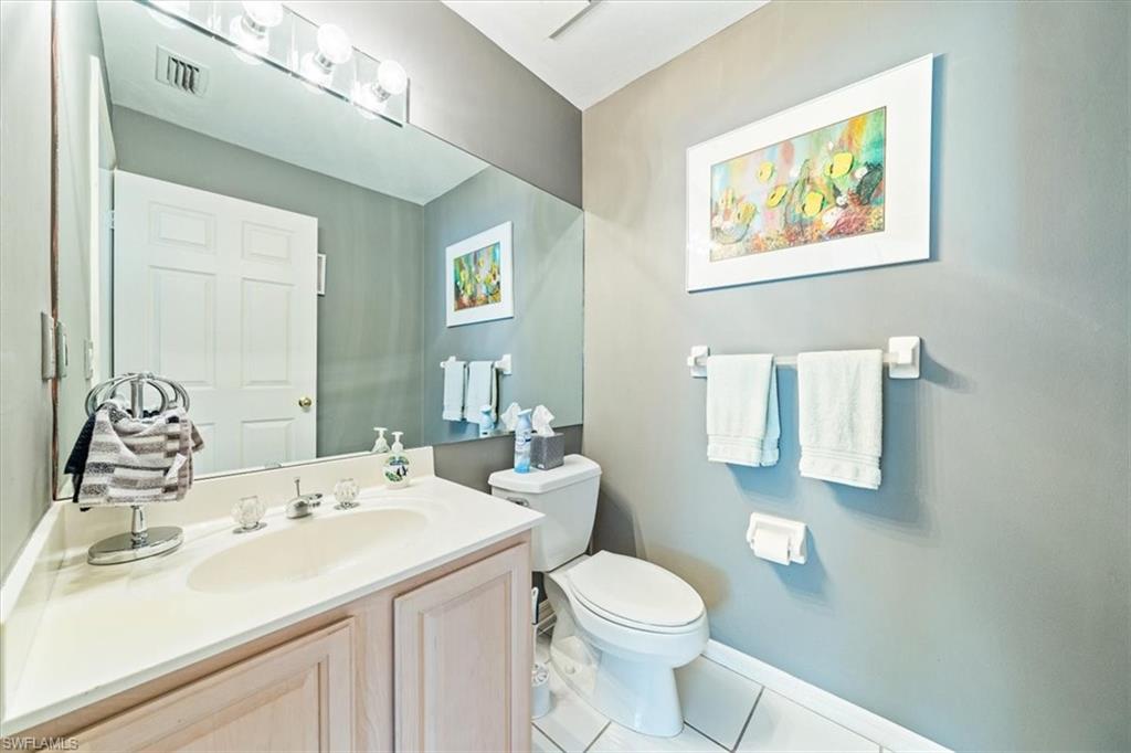 231 Via Perignon, Unit 204 Naples, FL 34119 - Photo 17 of 26 a bathroom with a sink and a mirror