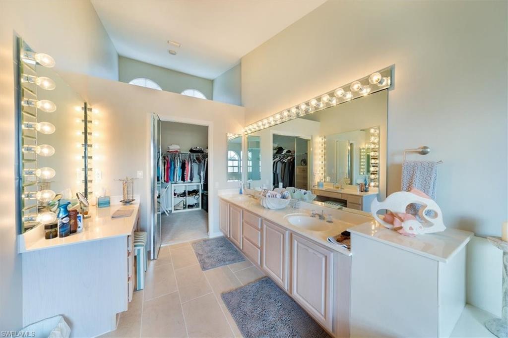 231 Via Perignon, Unit 204 Naples, FL 34119 - Photo 22 of 26 a large white kitchen with a large window