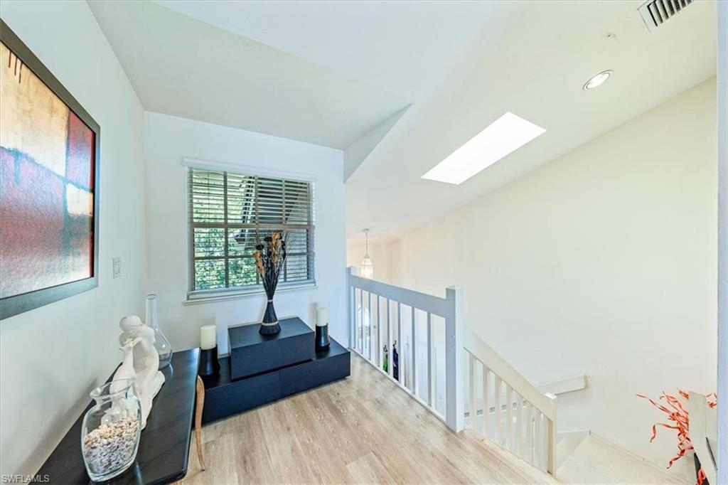 231 Via Perignon, Unit 204 Naples, FL 34119 - Photo 4 of 26 a living room with furniture and a window