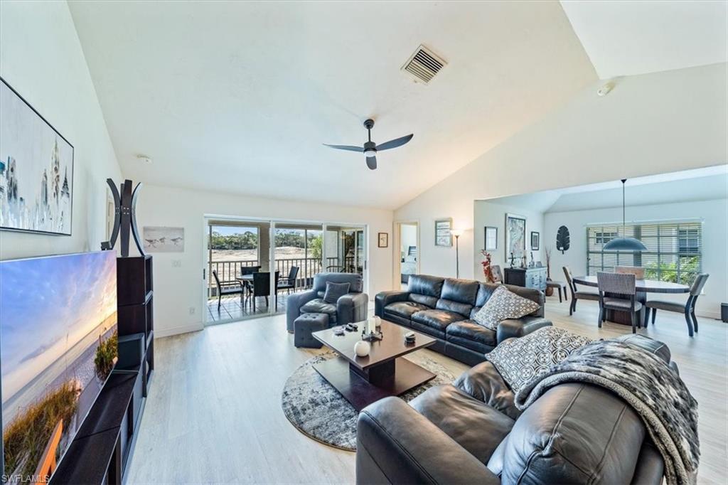 231 Via Perignon, Unit 204 Naples, FL 34119 - Photo 5 of 26 a living room with furniture and a window