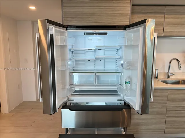 a bathroom with a shower and a mirror