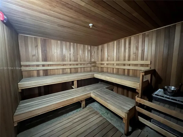 a kitchen with wooden cabinets and outdoor seating