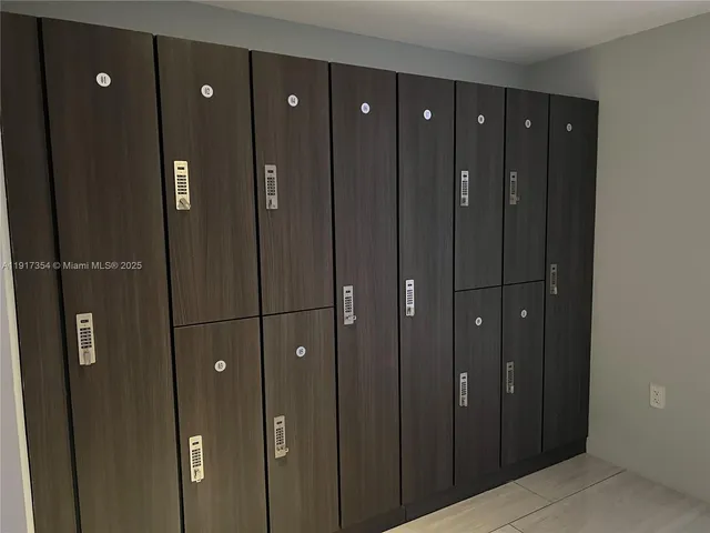 a bathroom with sliding door and shower