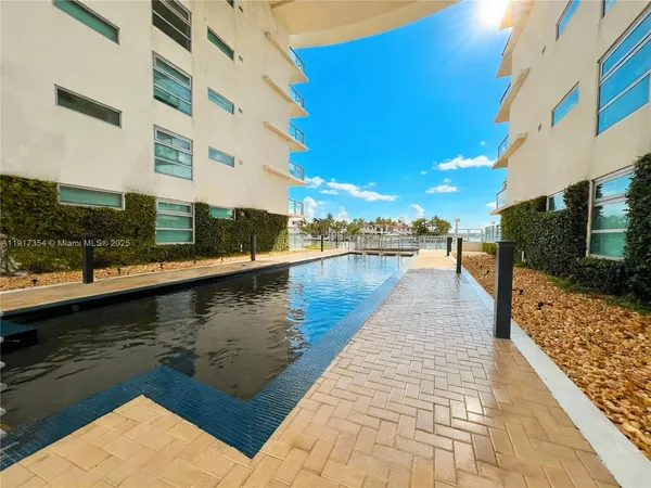 a view of a swimming pool with a lake view