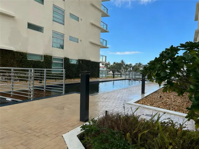 a view of a lake with a yard