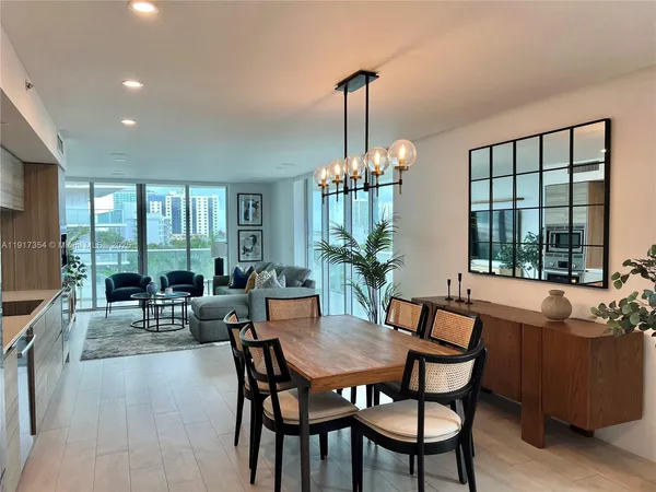 a view of a dining room with furniture window and outside view