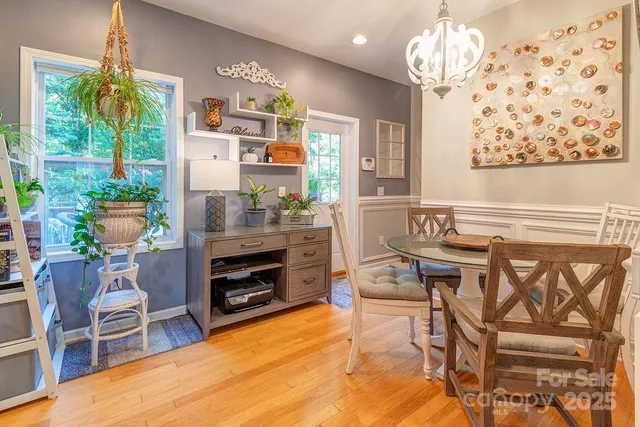 a room with furniture a chandelier and a window