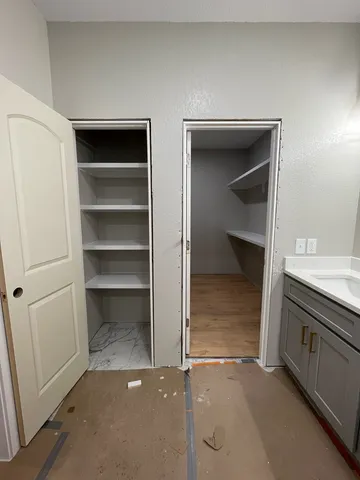 a view of an empty walk in closet