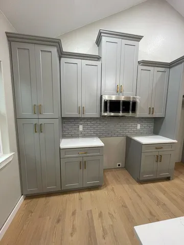 a bathroom with a tub sink and mirror