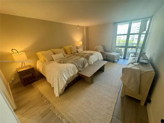 a spacious bedroom with a bed and a couch