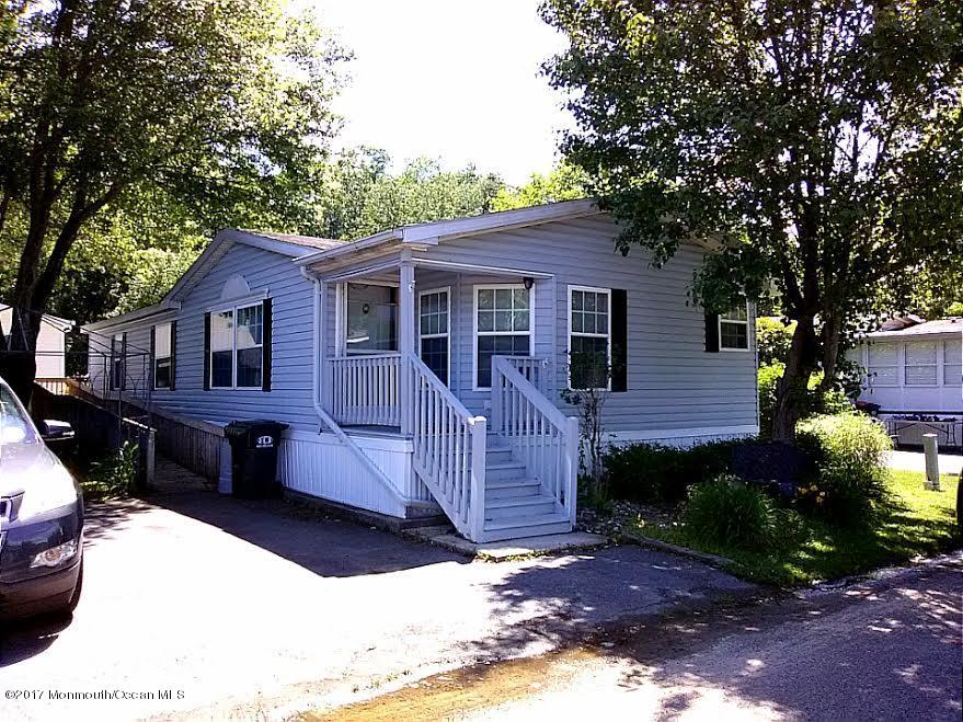 30 Village Road Morganville, NJ 07751 - Photo 1 of 25 a front view of a house with a yard