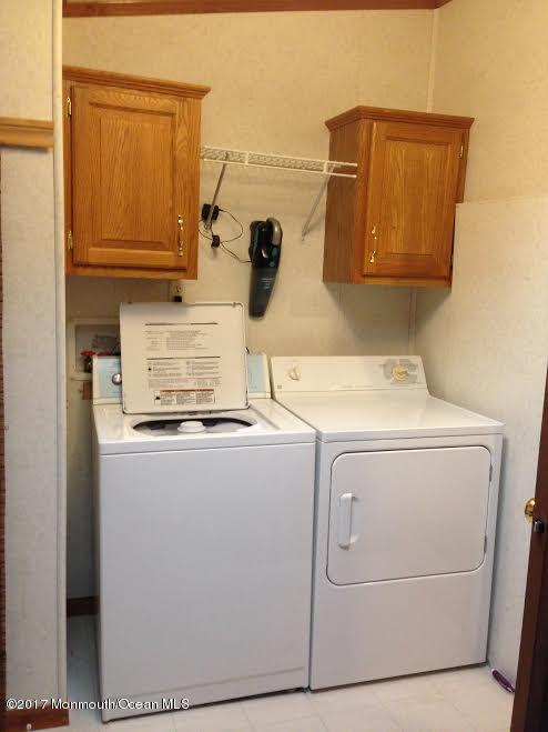 30 Village Road Morganville, NJ 07751 - Photo 13 of 25 a utility room with dryer and washer