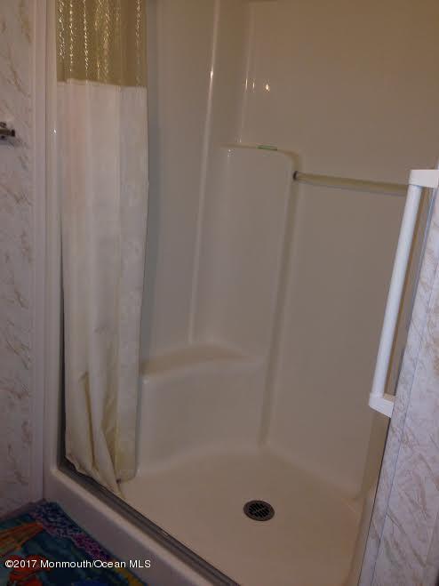30 Village Road Morganville, NJ 07751 - Photo 18 of 25 a bathroom with a shower