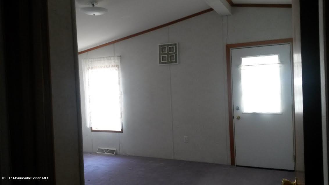 30 Village Road Morganville, NJ 07751 - Photo 20 of 25 a view of an empty room and a window