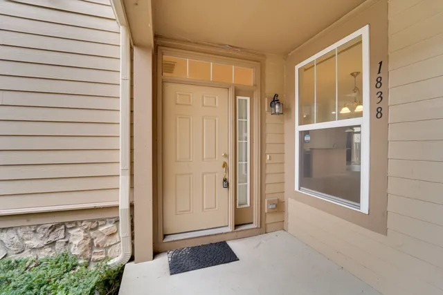 a view of a kitchen with a sink and a chandelier