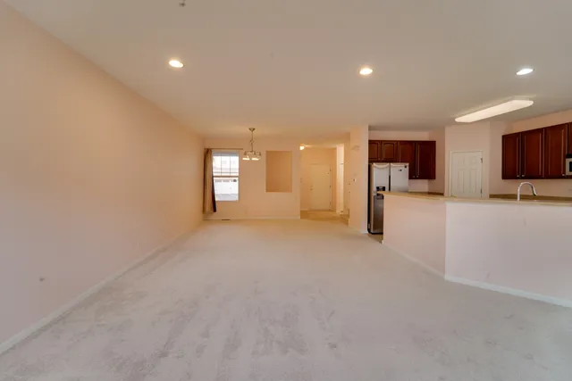 a view of a kitchen with a sink and cabinets