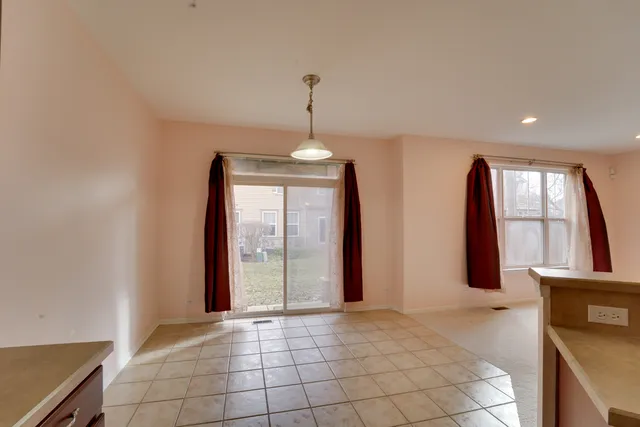 a kitchen with stainless steel appliances a sink a stove a refrigerator cabinets and a counter top space