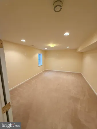 an empty room with a empty space and a window