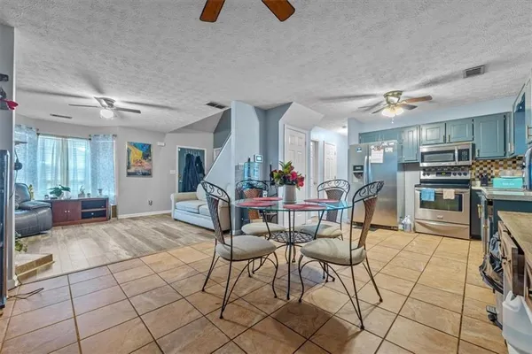 a view of a dining room kitchen counter top and dining room
