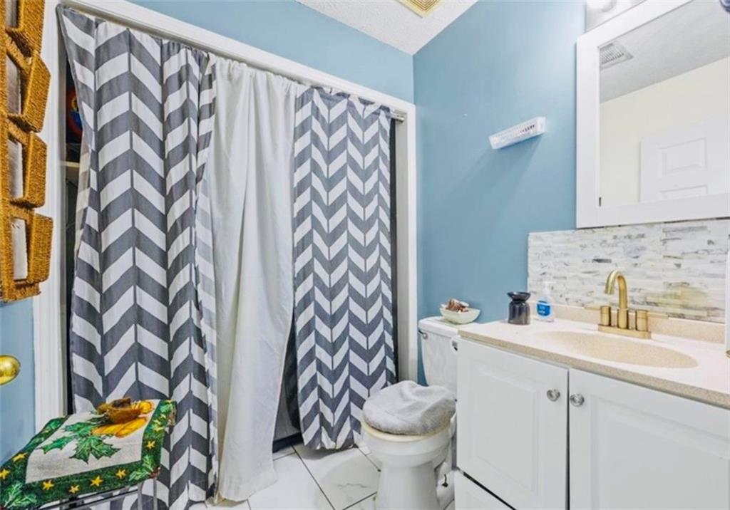 145 Turning Point Stockbridge, GA 30281 - Photo 15 of 21 a bathroom with a sink toilet and shower