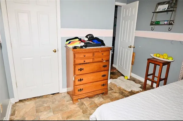 a bed room with a bed and a dresser