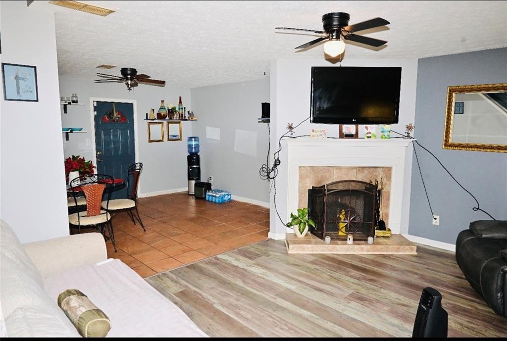 145 Turning Point Stockbridge, GA 30281 - Photo 8 of 21 a living room with furniture a flat screen tv and a fireplace