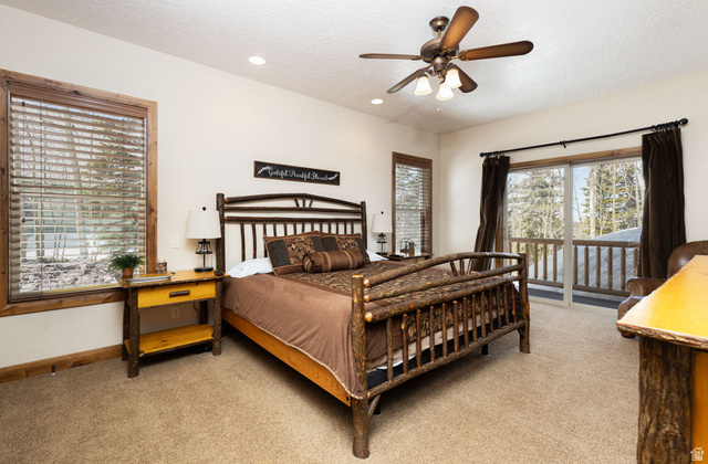382 Ridgeview Street, Unit 8 & 9 Brian Head, UT 84719 - Photo 35 of 52 Spacious bedroom featuring light beige walls and textured carpeting