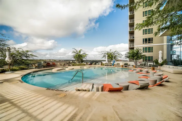 a view of swimming pool with outdoor seating