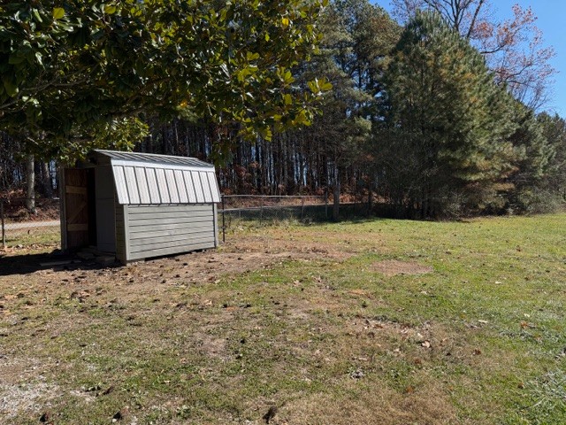 1758 Midway Road Sewanee, TN 37375 - Photo 11 of 15 a view of a backyard with large trees and wooden fence