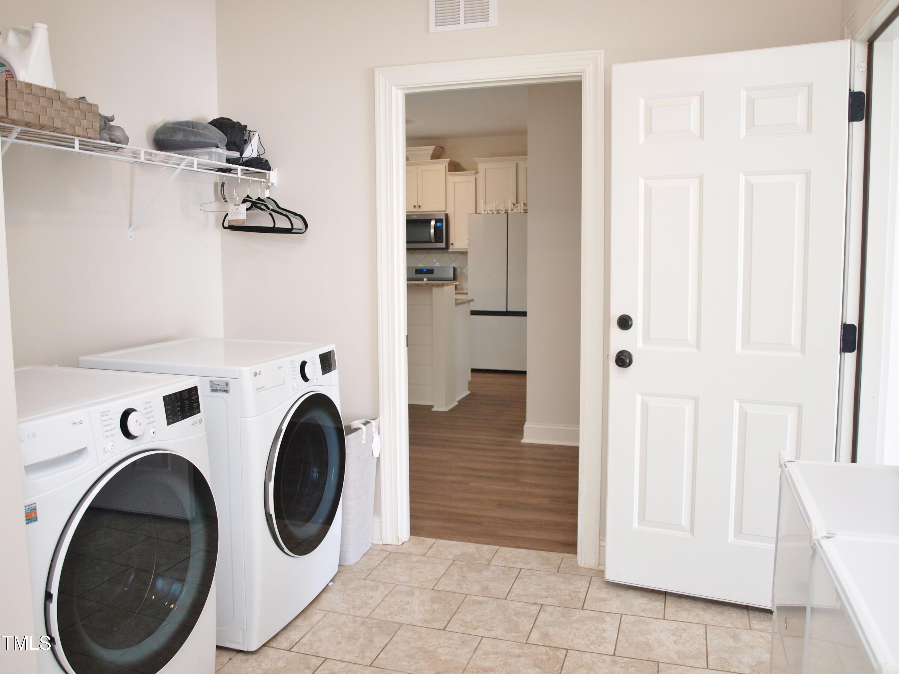 417 Airedale Trail Garner, NC 27529 - Photo 12 of 26 a view of a hallway with washer and dryer