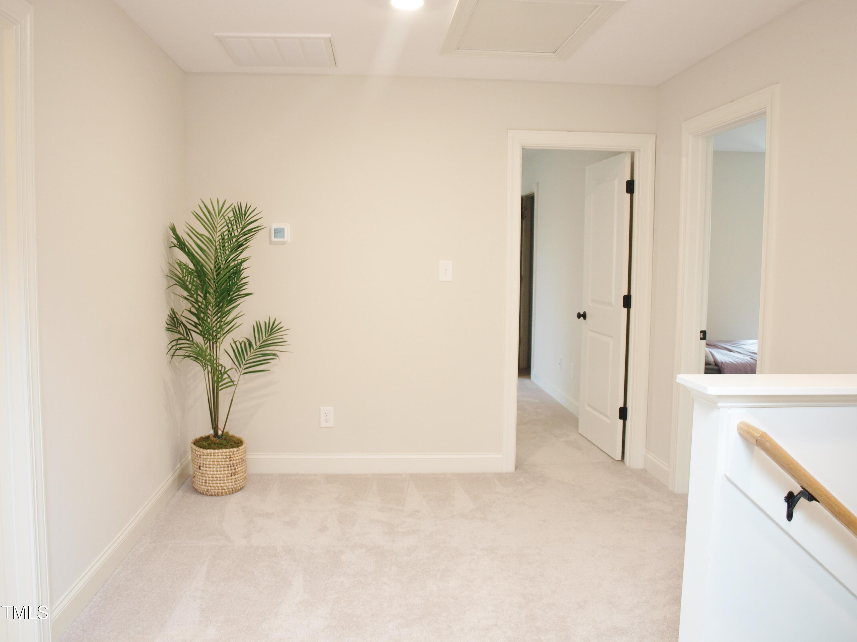 417 Airedale Trail Garner, NC 27529 - Photo 18 of 26 a view of a hallway with a potted plant
