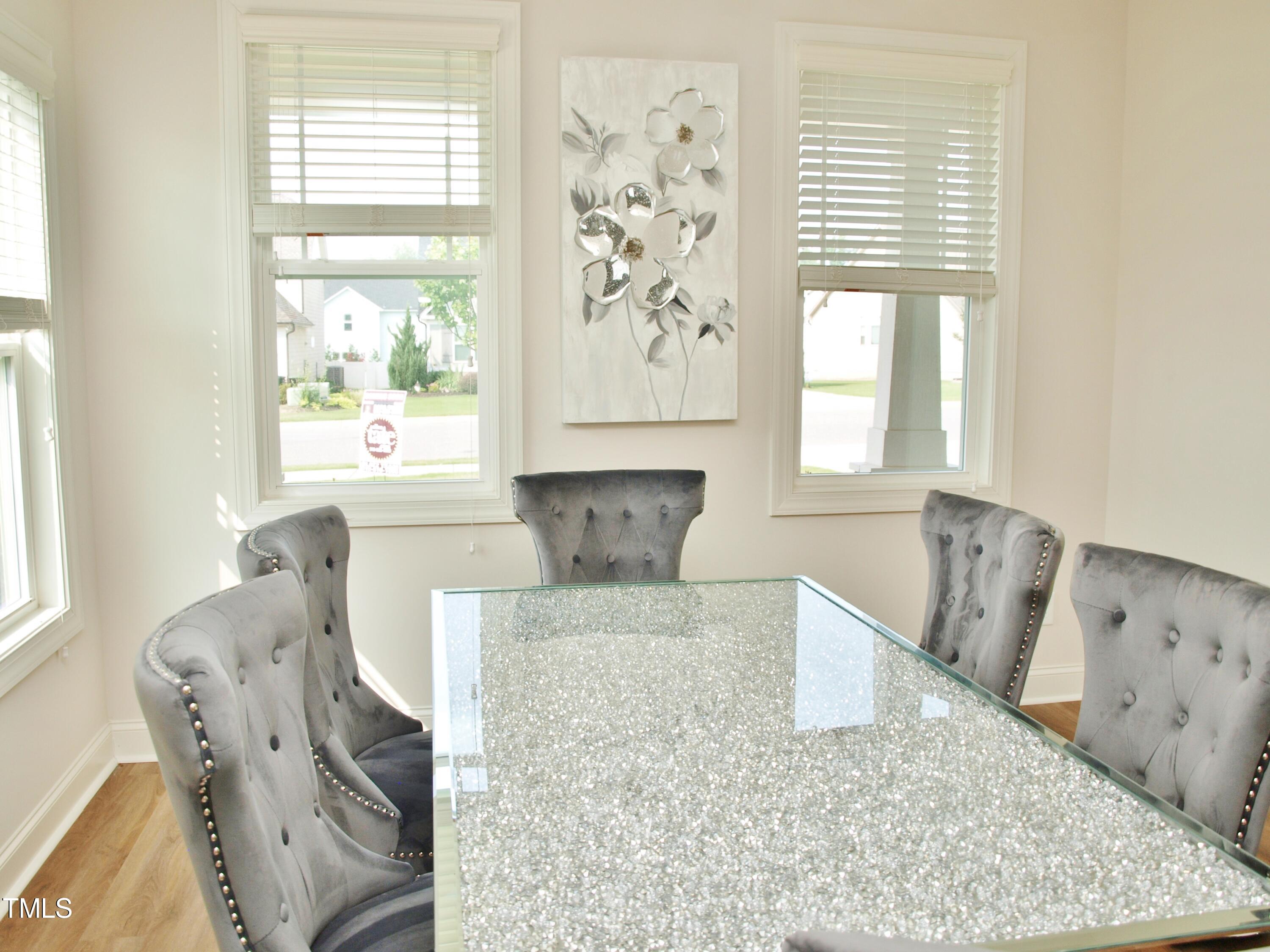 417 Airedale Trail Garner, NC 27529 - Photo 5 of 26 a living room with furniture and a large window