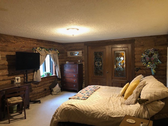 300 Roy Pitt Road Springfield, TN 37172 - Photo 20 of 26 a bedroom with a bed and a television