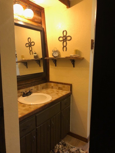 300 Roy Pitt Road Springfield, TN 37172 - Photo 8 of 26 a bathroom with a granite countertop sink and a mirror