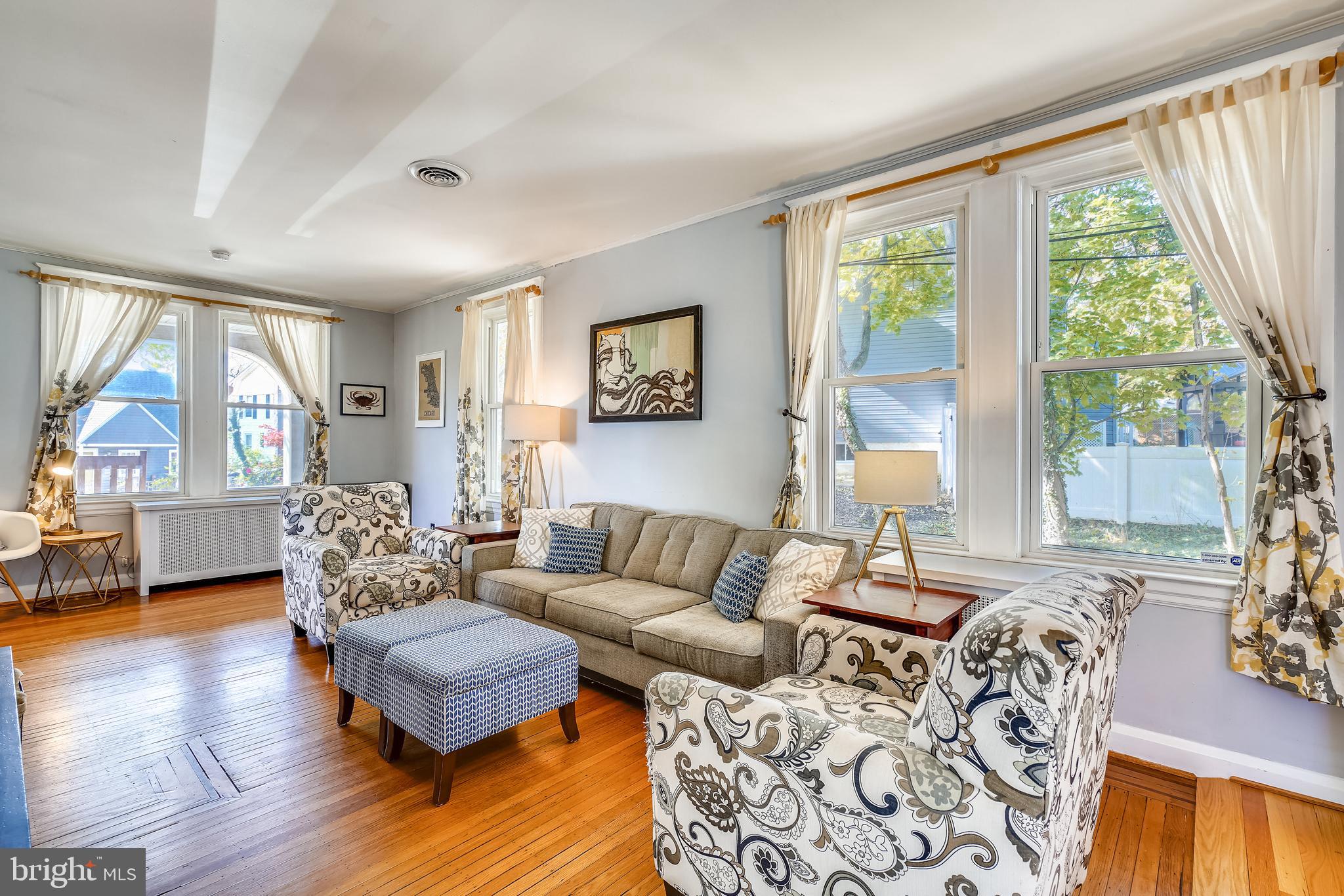 910 Overbrook Road Baltimore, MD 21239 - Photo 12 of 50 a living room with furniture and a large window