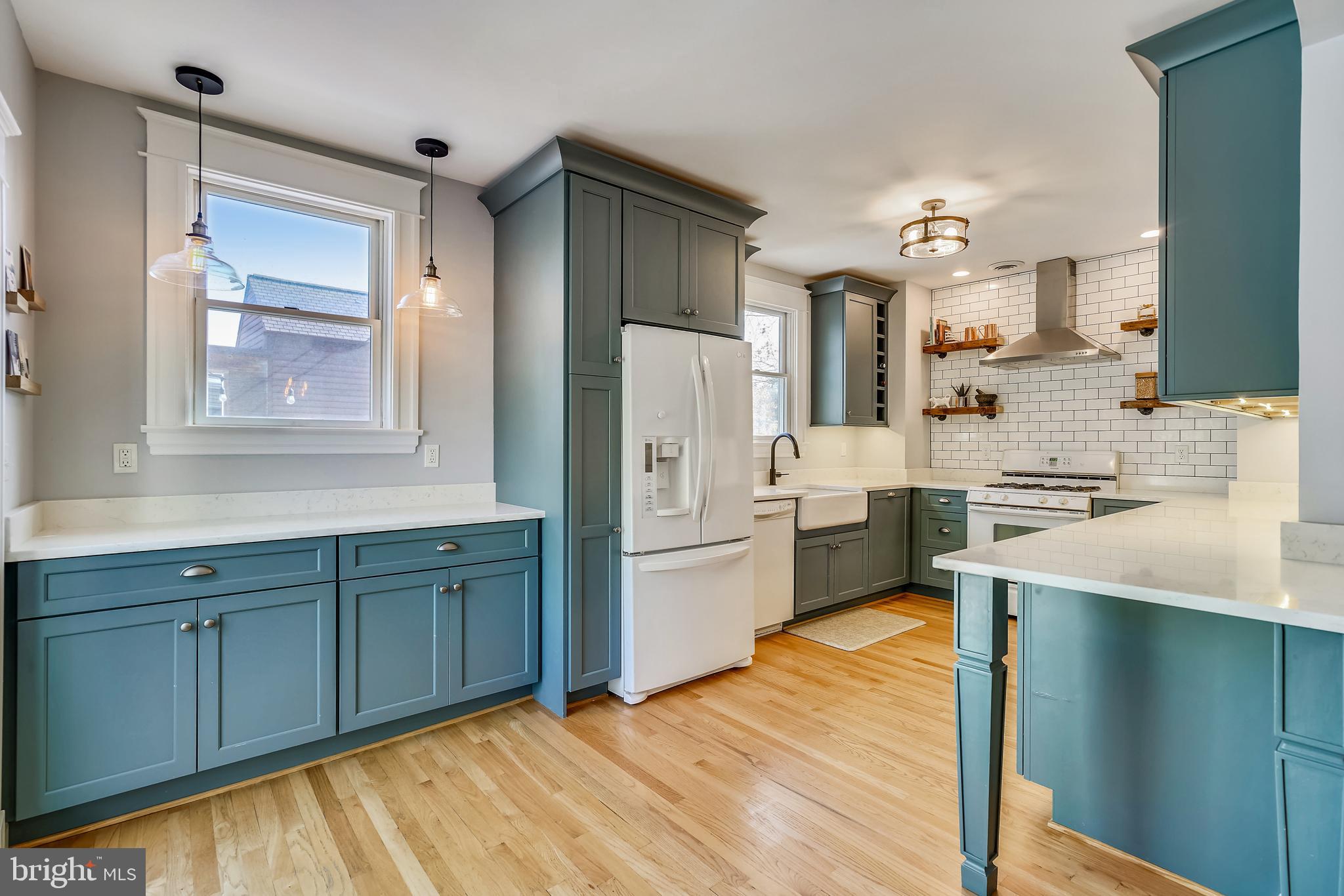 910 Overbrook Road Baltimore, MD 21239 - Photo 18 of 50 a kitchen with a sink cabinets stainless steel appliances and a window