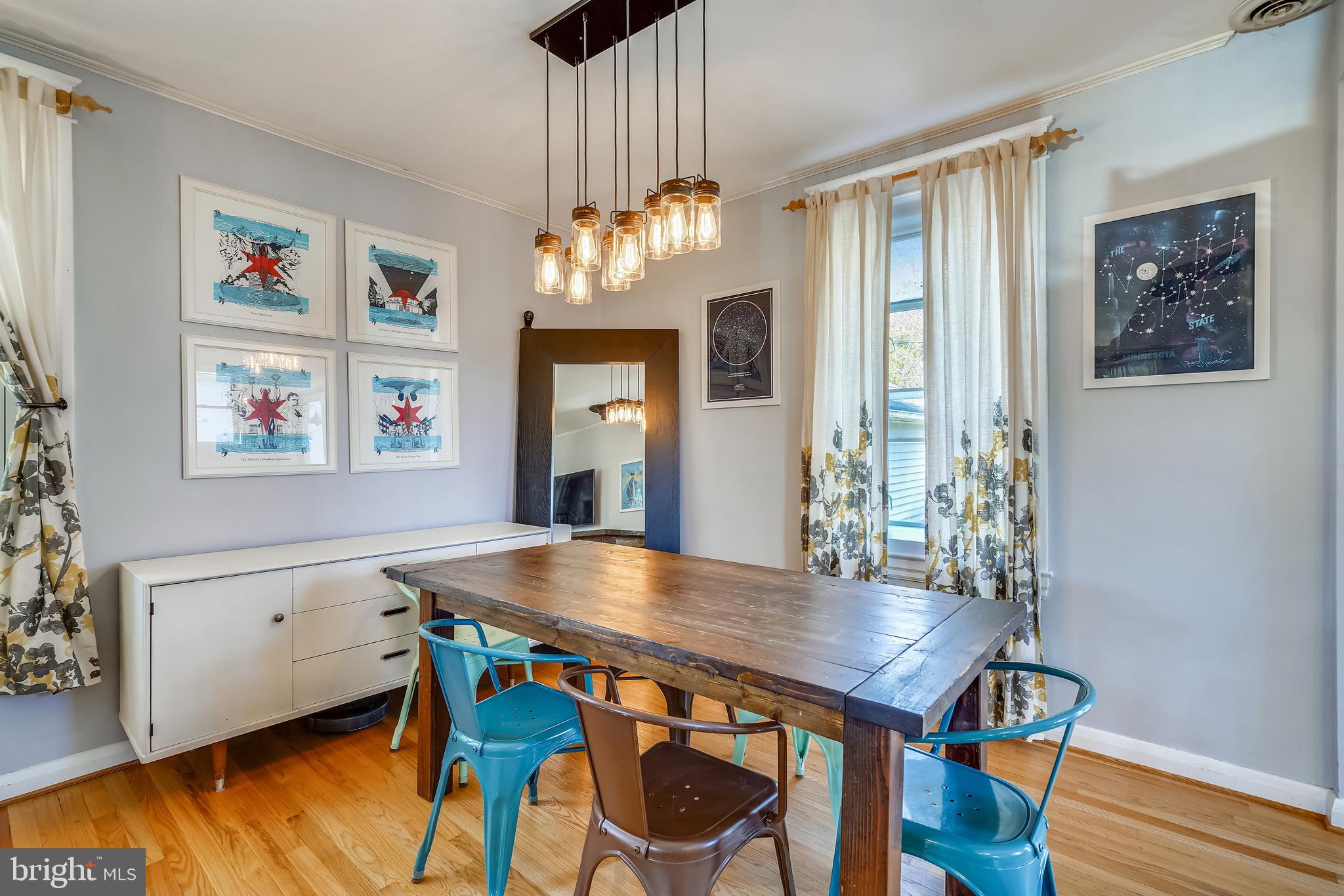 910 Overbrook Road Baltimore, MD 21239 - Photo 3 of 50 a view of a dining room with furniture and wooden floor