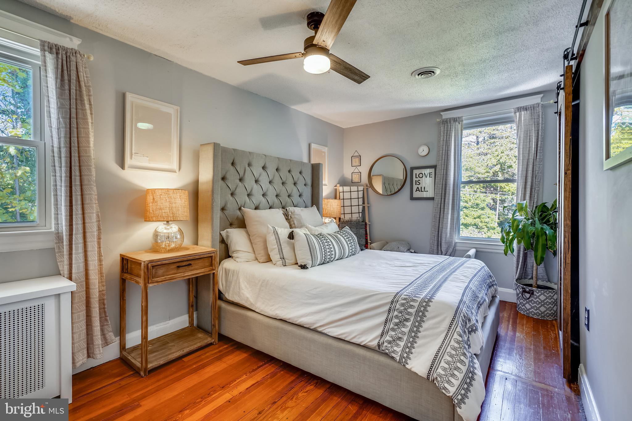 910 Overbrook Road Baltimore, MD 21239 - Photo 26 of 50 a bedroom with a bed and a window